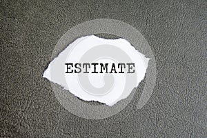 estimate sign on the torn paper on the gray background