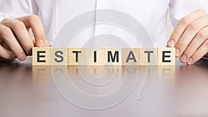 ESTIMATE word made with building blocks, business concept