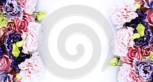 Estive floral arrangement in pastel colors. Purple and pink flowers on white background.