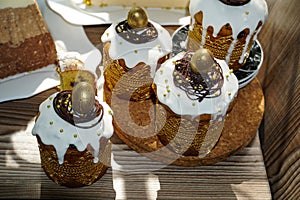 Estive table for Easter. A lot of Easter cakes from curd dough decorated with chocolate and chocolate quail eggs, curd Easter,