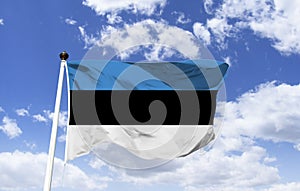 Estonian flag mockup, fluttering under a blue sky