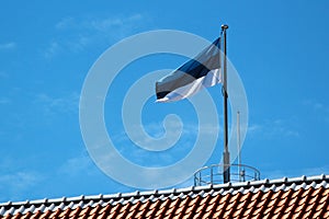 Estonian flag on Tall Hermann Tower in Old Town of Tallinn, Estonia