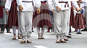 Estonian people in traditional clothing walking the streets of Tallinn