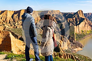estranged angry couple think about their divorce in breathtaking scenery of mountains and red cliffs