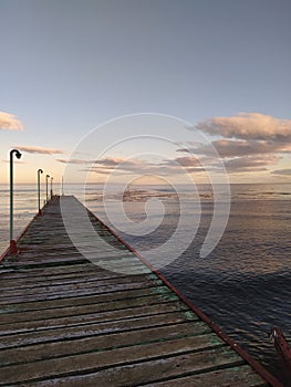 Estrecho de Magallanes, Punta Arenas, Magallanes, Chile. Water, clouds and sunset photo