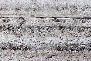 Etailed close up view on concrete wall textures with cracks and lots of stucture in high resolution
