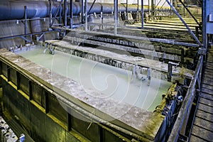 Etching acid containers for galvanizing metal parts in galvanic workshop photo