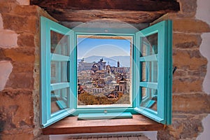 Eternal city of Rome landmarks an rooftops skyline view through window