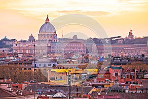 Eternal city of Rome rooftops and Vatican Basilica of Saint Peter golden sunset view