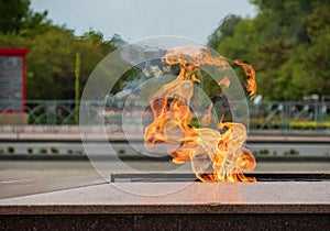 Fire flame symbol memory event monument monument town city street background traffic motor transport flames heat temperature tempe