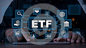 ETF,Exchange traded fund.Businessmen using a tablet with icons of ETF.Business finance concept.Stock market index fund