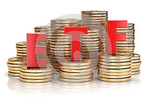 ETF exchange traded fund onthe stacks of golden coins. Stock exchenge and investment concept. photo