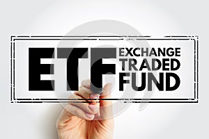 ETF Exchange Traded Fund - type of investment fund and exchange-traded product, they are traded on stock exchanges, acronym text