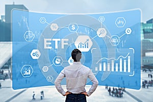 ETF Exchange-Traded Funds investment with investor building a portfolio of financial assets on market such as stock, bonds, photo