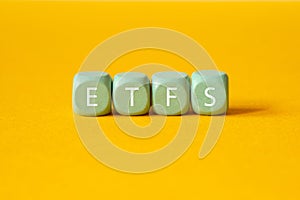 ETFs - Exchange Traded Fund , word concept on building blocks, text