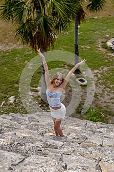 Ethereal Journey: A Young Beauty's Sojourn through Xcambo Mayan Ruins in Telchec, Yucatan, Amidst a Caribbean Oasis photo