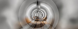 An ethereal, minimalist vision of a bare railway track cutting through an abstract, cavernous tunnel. photo