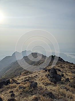 Ethereal Sunrise Embrace: Kalsubai's Majesty Unveiled(Selective focus)