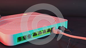 Ethernet cable on the back of the internet router. A shot showing high-speed wired or wireless internet. 5g internet