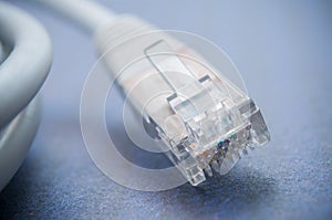 Ethernet RJ45 white Network Cable on blue background