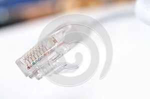 Ethernet RJ45 white Network Cable on white desk backg