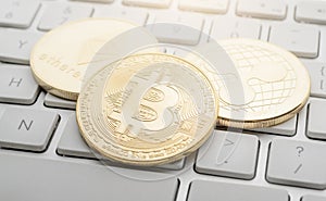 Etherum, Bitcoin, Ripple on the keyboard