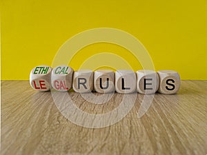 Ethical or legal rules symbol. Turned wooden cubes and changes words