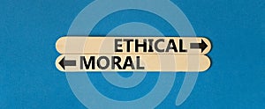 Ethical or moral symbol. Concept word Ethical or Moral on beautiful wooden stick. Beautiful blue table blue background. Business