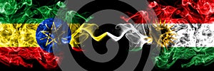 Ethiopia, Ethiopian vs Kurdistan, Kurdish, Kurds smoky mystic flags placed side by side. Thick colored silky abstract smoke flags