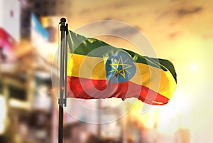 Ethiopia Flag Against City Blurred Background At Sunrise Backlight