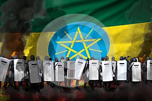 Ethiopia police guards in heavy smoke and fire protecting order against riot - protest stopping concept, military 3D Illustration