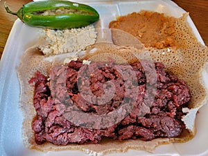 Ethiopian food kitfo raw beef and injera bread