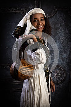 Ethiopian model with gourd handbag