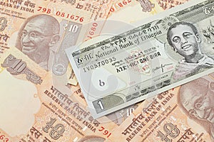 An Ethiopian one birr bank note with Indian ten rupee bank notes