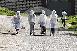 Ethiopian Orthodox women wearing white capes heading towards church in Addis Ababa Ethiopia