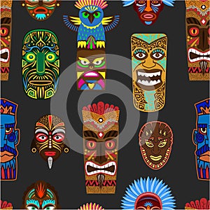 Ethnic african or mexican aborigen masks vector seamless pattern. Afro totem or warriors wooden ornament masks with