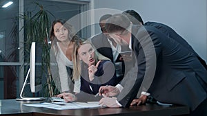 Ethnic business people working at office, doing paper work