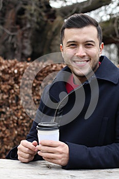 Ethnic businessman taking a coffee break