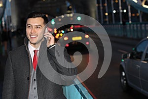 Ethnic businessman walking the city street at night