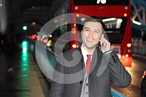 Ethnic businessman walking the city street at night