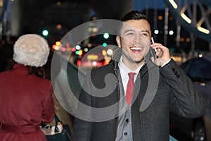 Ethnic businessman walking the city street at night