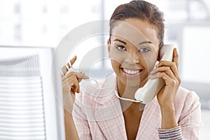 Ethnic businesswoman on landline call