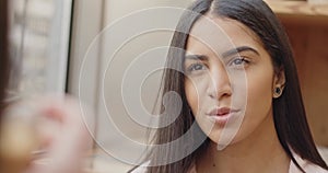 Ethnic businesswoman speaking looking at the camera. Portrait of a woman talking with a colleague.Close up of a multi