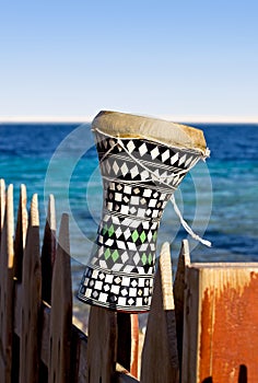 Ethnic drum with a sea background. darbuka.