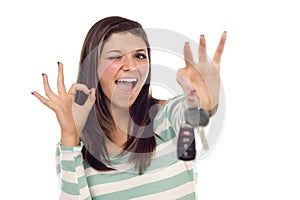 Ethnic Female with Car Keys and Okay Hand Sign