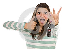 Ethnic Female with Car Keys and Thumbs Up on White