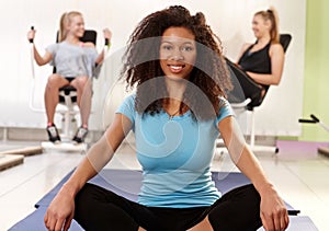 Ethnic girl relaxing at the gym