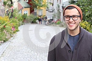 Ethnic hipster wearing eyeglasses and knit hat