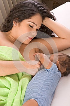 Ethnic Hispanic Mother breastfeeding her son