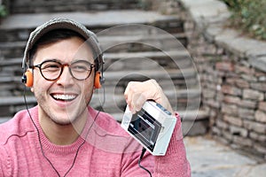 Ethnic male listening to a cassett